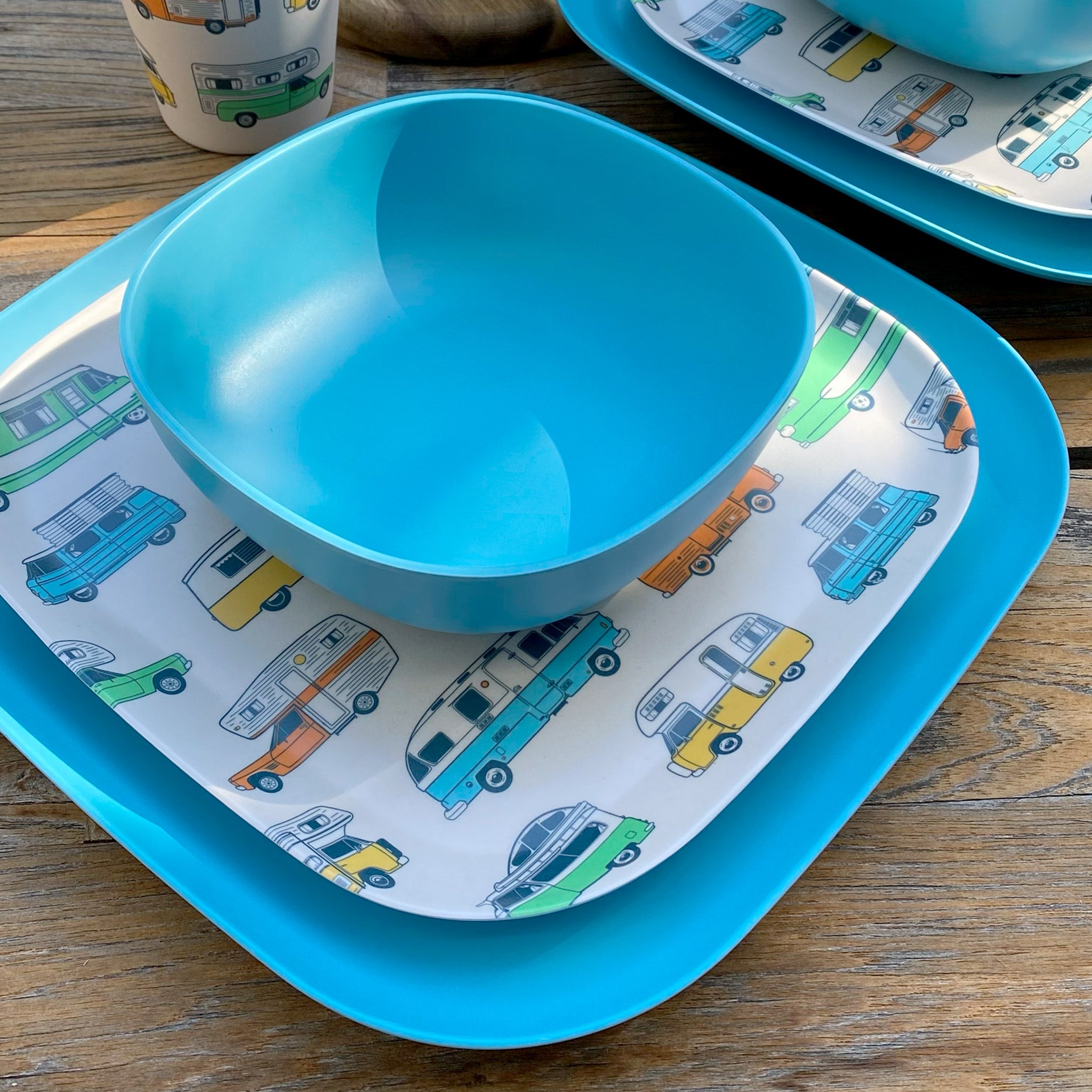 Van Go Camper 8 piece bamboo dinnerware set - closeup of motorhome plate with pale blue camping bowl and large plate