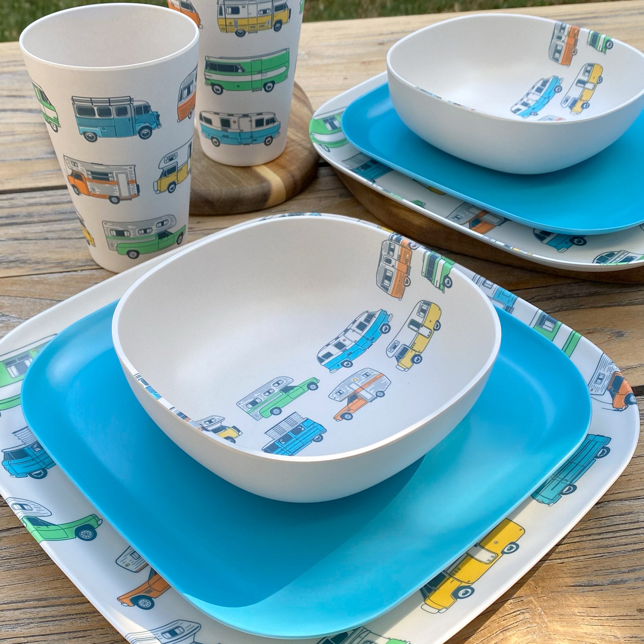 Van Go Camper 8 piece bamboo dinnerware set for 2 people - camping plate, bowl and tumblers plus pale blue plates on table