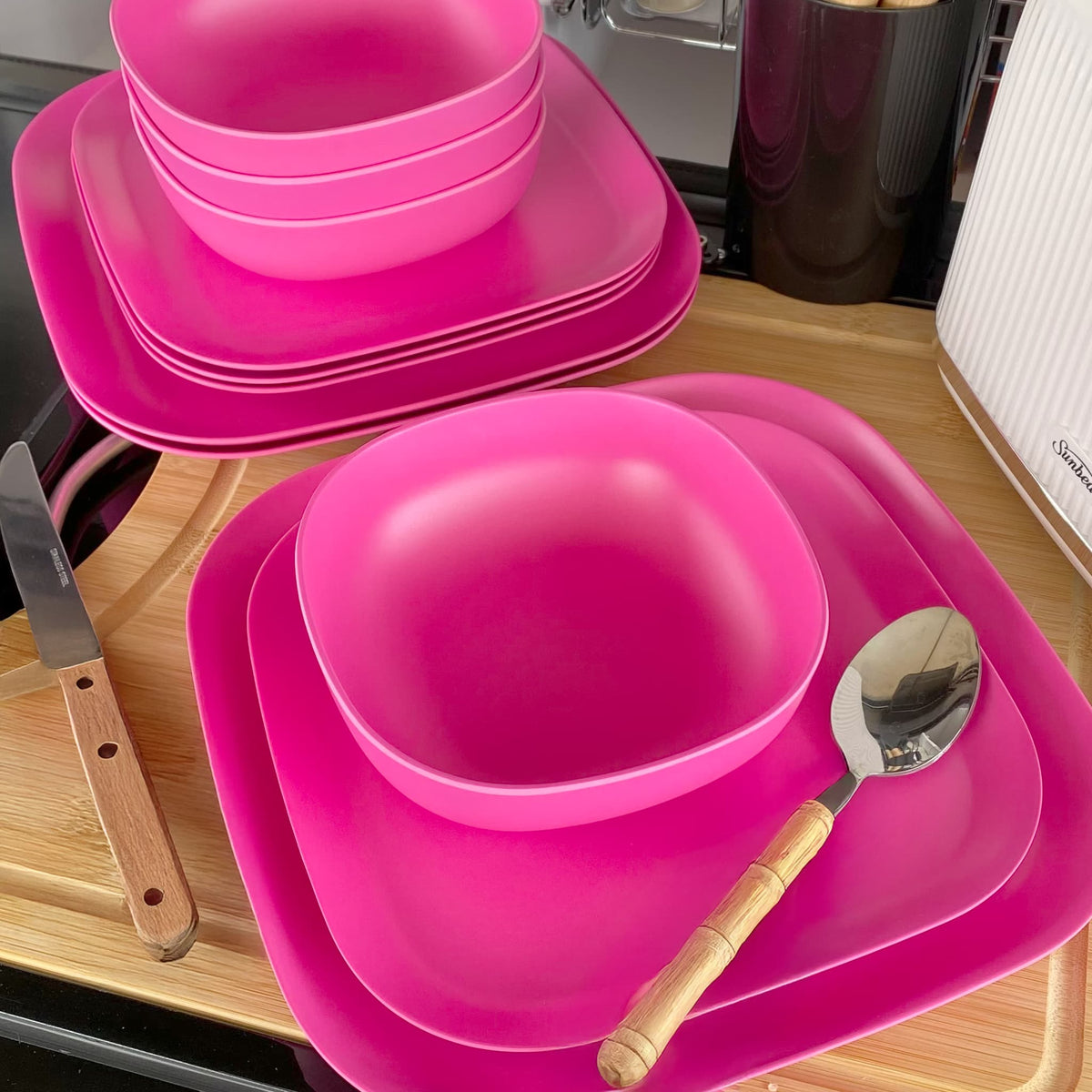 4 piece bamboo cereal bowl set, plus 22cm plate set and 26cm plate set in vintage pink, stacked and flat