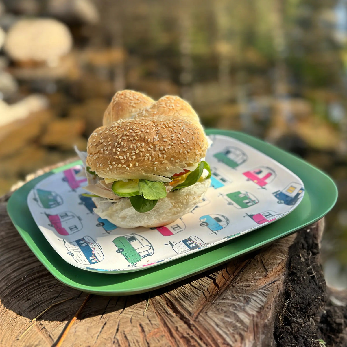bamboo 26cm plate in classic green with iconic 22cm plate and salad roll, on timber stump