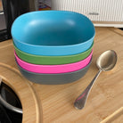 4 piece bamboo cereal bowl set, bush mix in classic green, vintage pink, pale blue and midnight grey, stacked with spoon