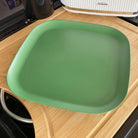bamboo plate 26cm in classic green, on caravan bench table