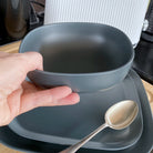 bamboo cereal bowl 15cm in midnight grey, destinations collection, held in hand