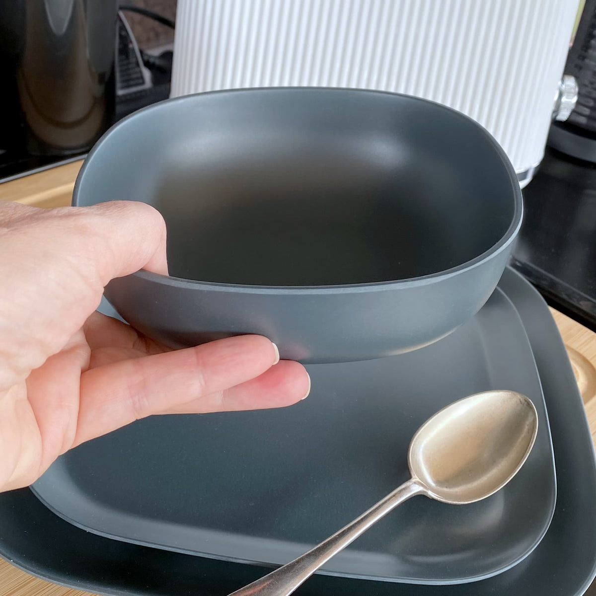 bamboo cereal bowl 15cm in midnight grey, destinations collection, held in hand