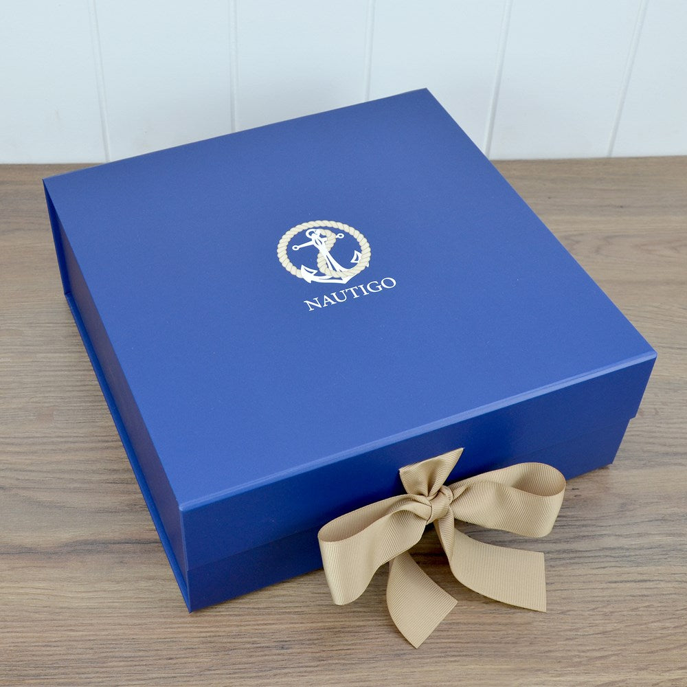 A Blue Van Go Collections NautiGo gift box with grosgrain ribbon