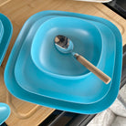 bamboo cereal bowl 15cm, 22cm and 26cm plates, in pale blue with spoon in bowl