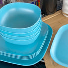4 piece bamboo cereal bowl set in pale blue, stacked with 22cm and 26cm plates