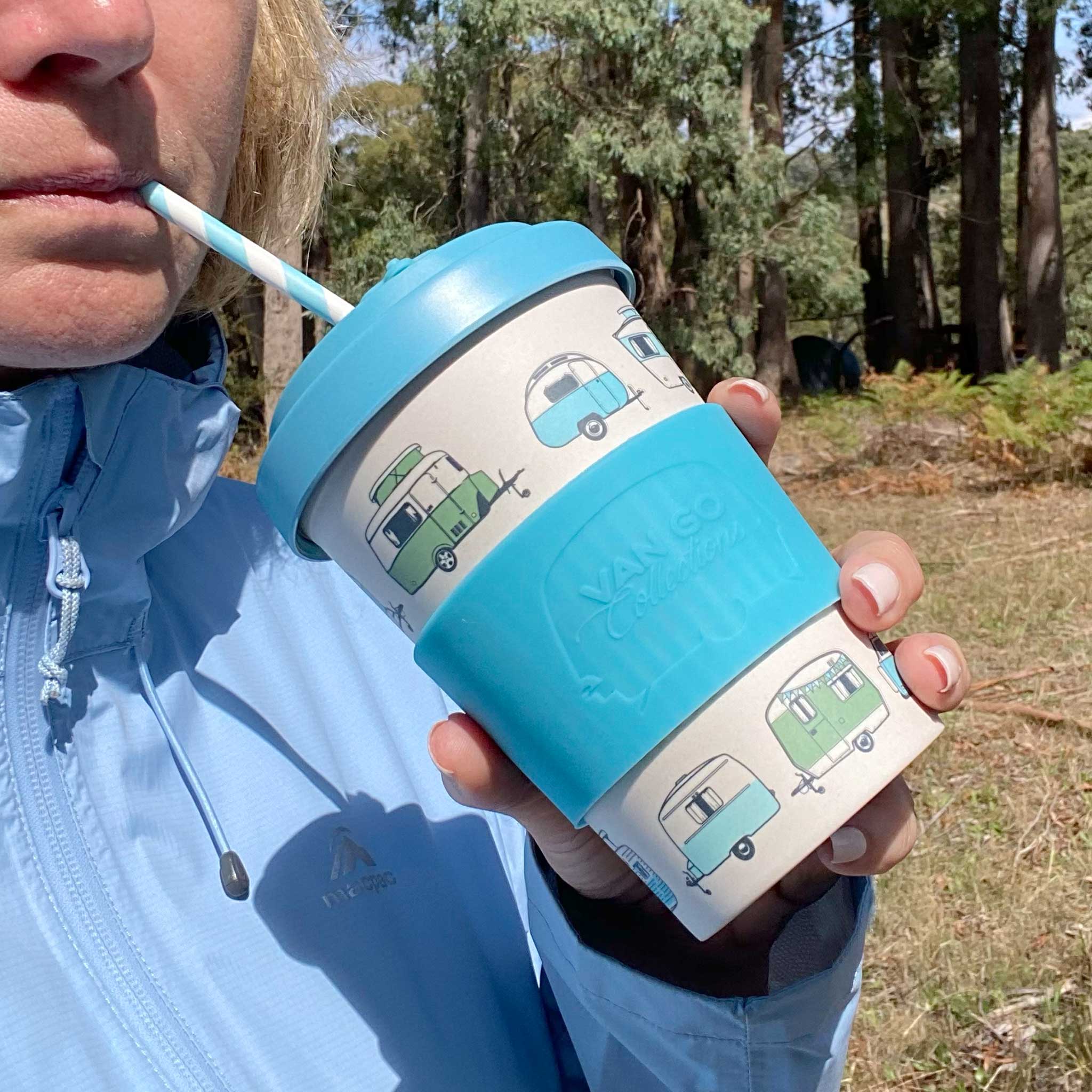 Van Go Bamboo Travel Mug 400ml, iconic caravan design pale blue BPA free reusable cup with spill proof lid and straw in hand