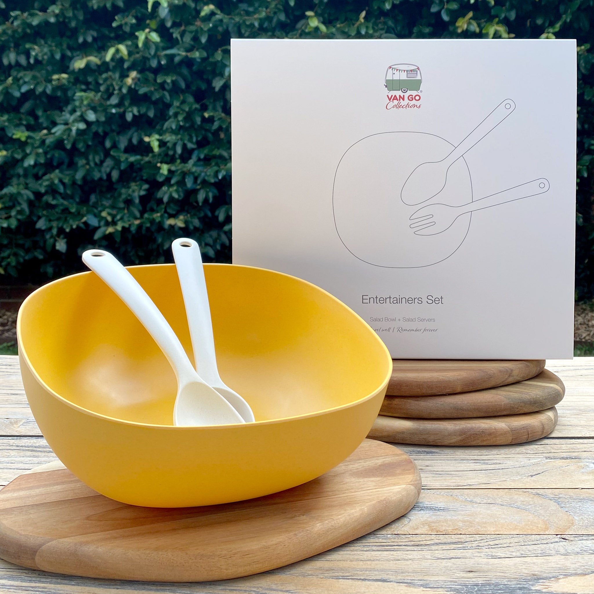 Van Go Bamboo Salad Bowl and Servers Set sunshine yellow salad bowl with natural salad servers displayed in front of boxed version on timber table