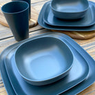 Van Go Caravan and camping 8 piece bamboo dinnerware set in classic midnight grey showing plate and bowl table setting