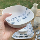 Van Go Caravan and camping 8 piece bamboo dinnerware set in destination collection with midnight grey caravan print including camping plates, bowls and tumblers plus bowl closeup on timber table