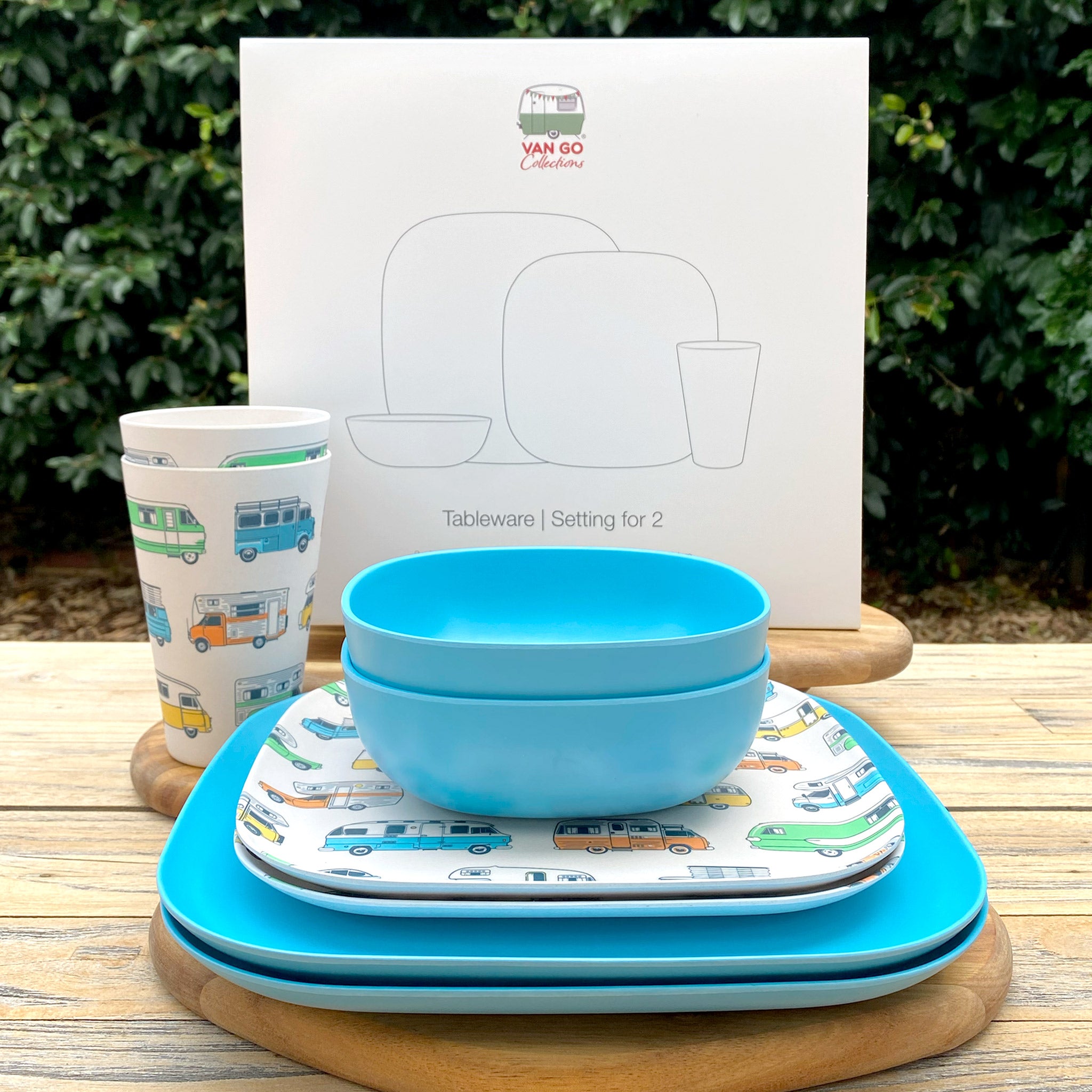 Van Go Caravan and camping 8 piece bamboo dinnerware set camper collection motorhome plate and campervan tumbler plus pale blue camping bowl and large plate stacked on timber table with gift box