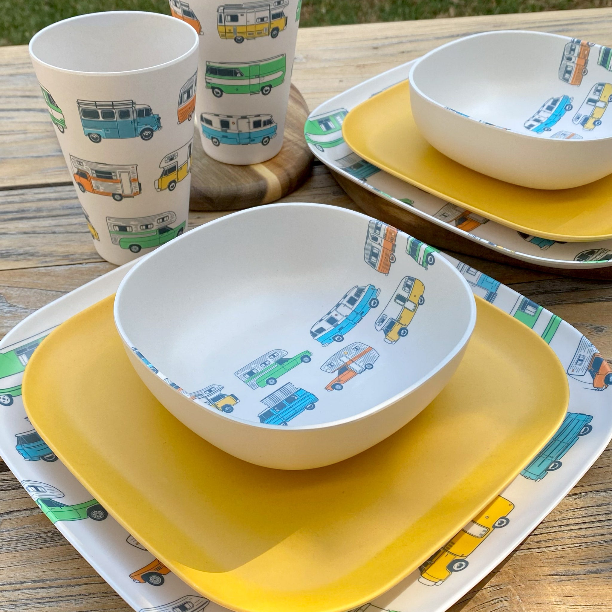 Van Go Caravan and camping 8 piece bamboo dinnerware set Camper plate, bowl and tumblers plus sunshine yellow plate on timber table cropped