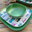 Van Go Caravan and camping 8 piece bamboo dinnerware set - iconic caravan print with classic green bowl and plate closeup