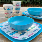 Van Go Caravan and camping 8 piece bamboo dinnerware set - caravan plate, tumbler plus pale blue camping bowl on timber table