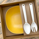 Van Go Bamboo Salad Bowl and Servers Set sunshine yellow salad bowl with natural salad servers displayed in brown gift box on timber table