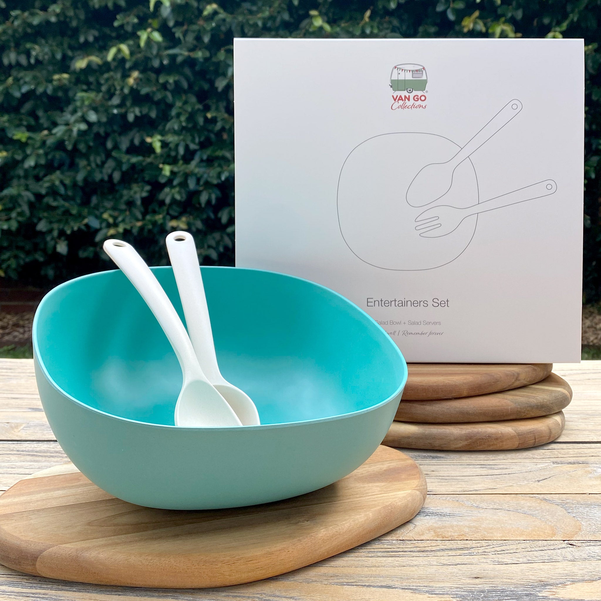 Van Go Bamboo Salad Bowl and Servers Set teal green salad bowl with natural salad servers displayed in front of boxed version on timber table