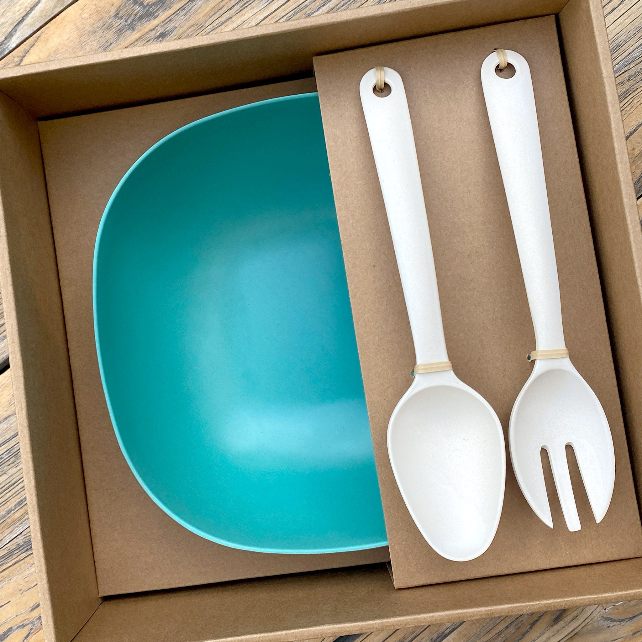 Van Go Bamboo Salad Bowl and Servers Set teal green salad bowl with natural salad servers displayed in brown gift box on timber table