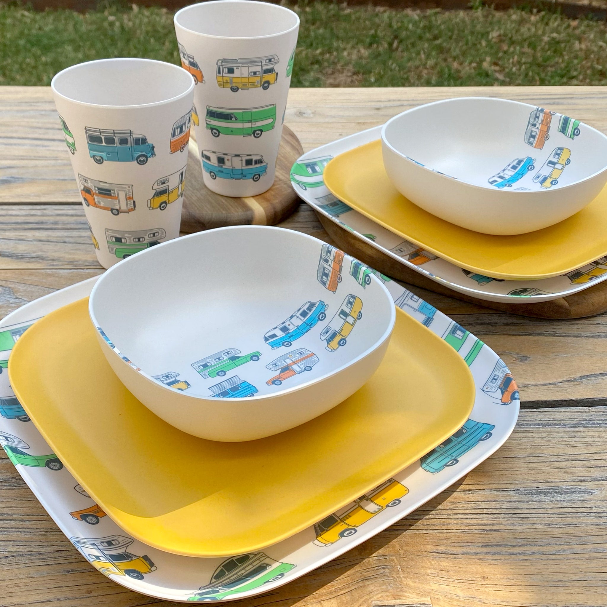 Van Go Caravan and camping 8 piece bamboo dinnerware set Camper plate, bowl and tumblers plus sunshine yellow plate on timber table