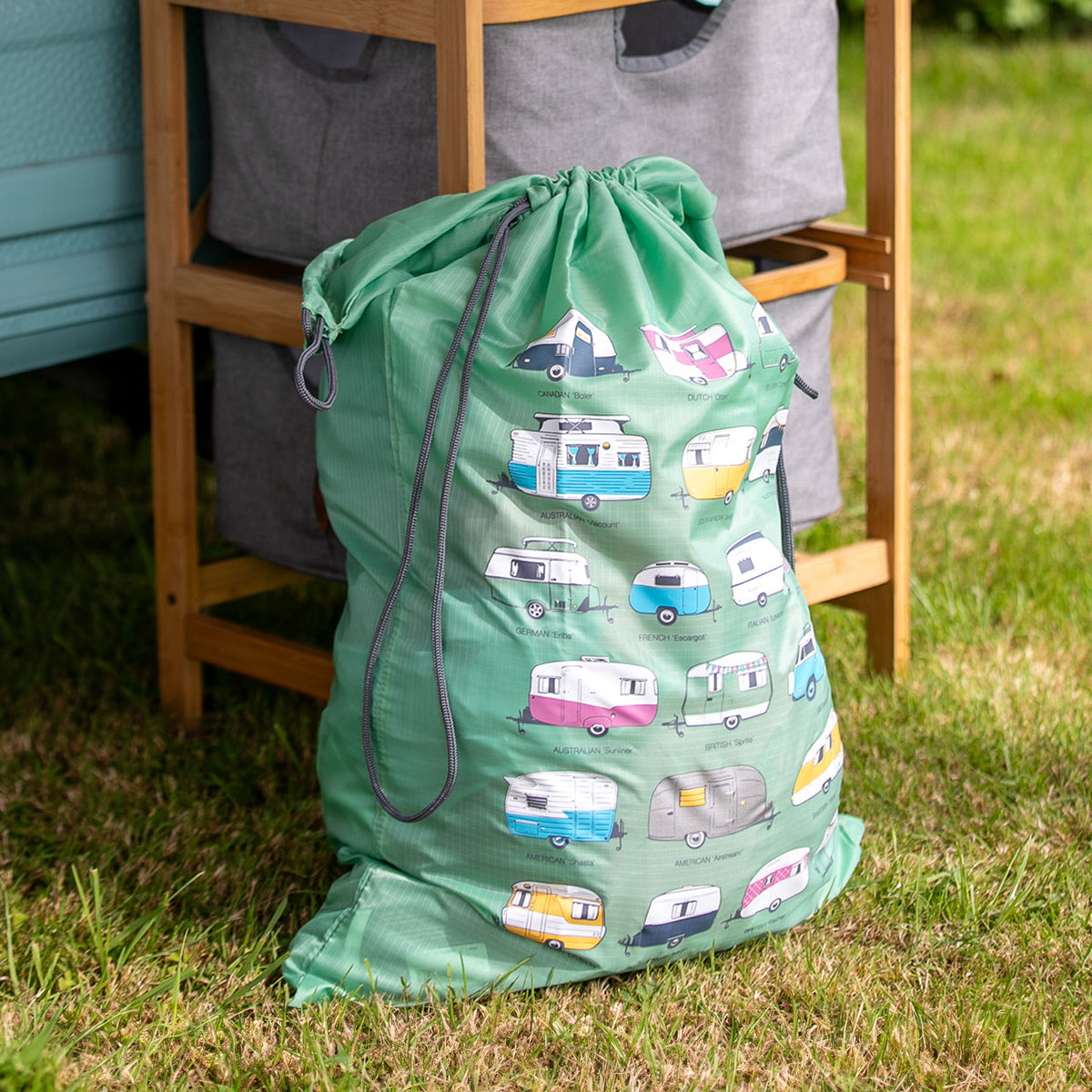 dirty clothes bag shown next to hamper outside camper van, expands to 90cm